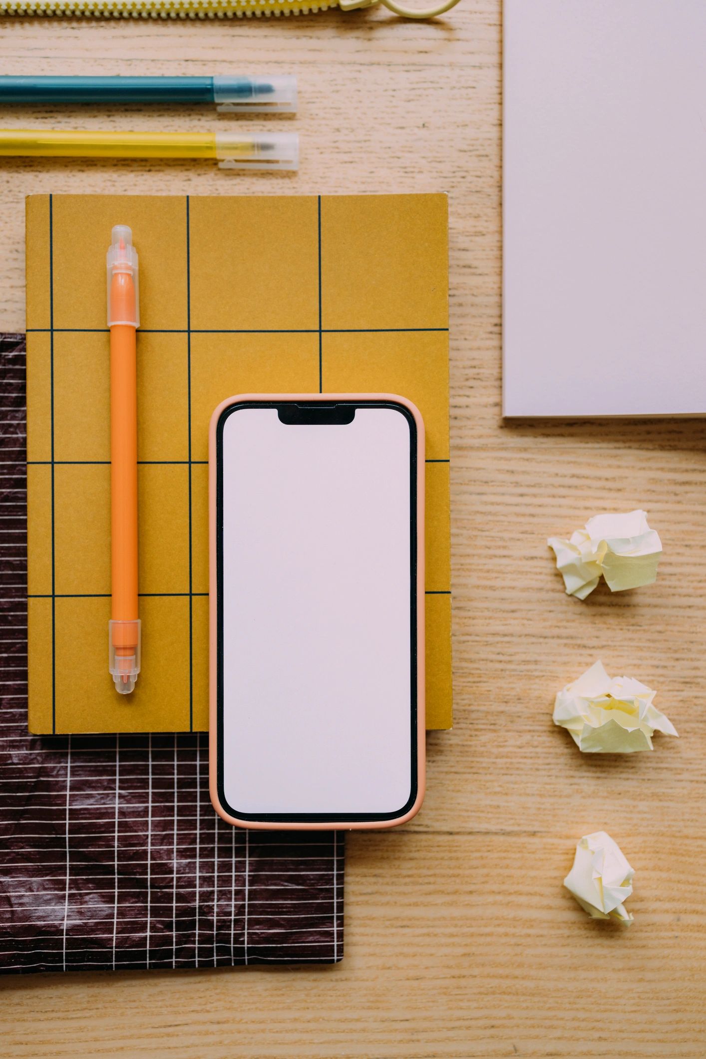 Workspace with smartphone and stationery