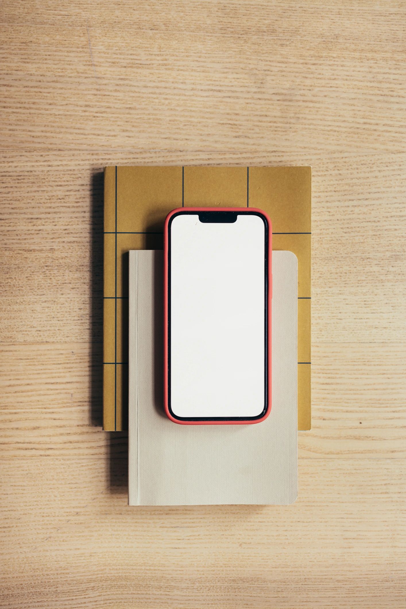 Smartphone mockup on notebooks